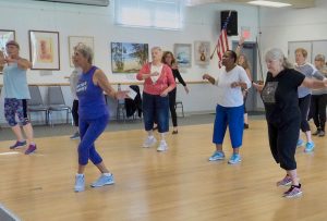 Maryann Grau leading a fitness class in Cambria