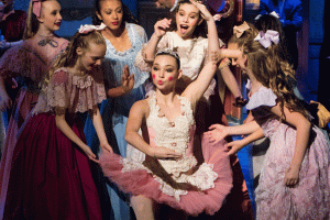 ballerinas gathered around Sugar Plum Fairy in the Nutcracker Ballet